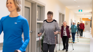 People with parkinson's walking in a hallway using their Activator poles