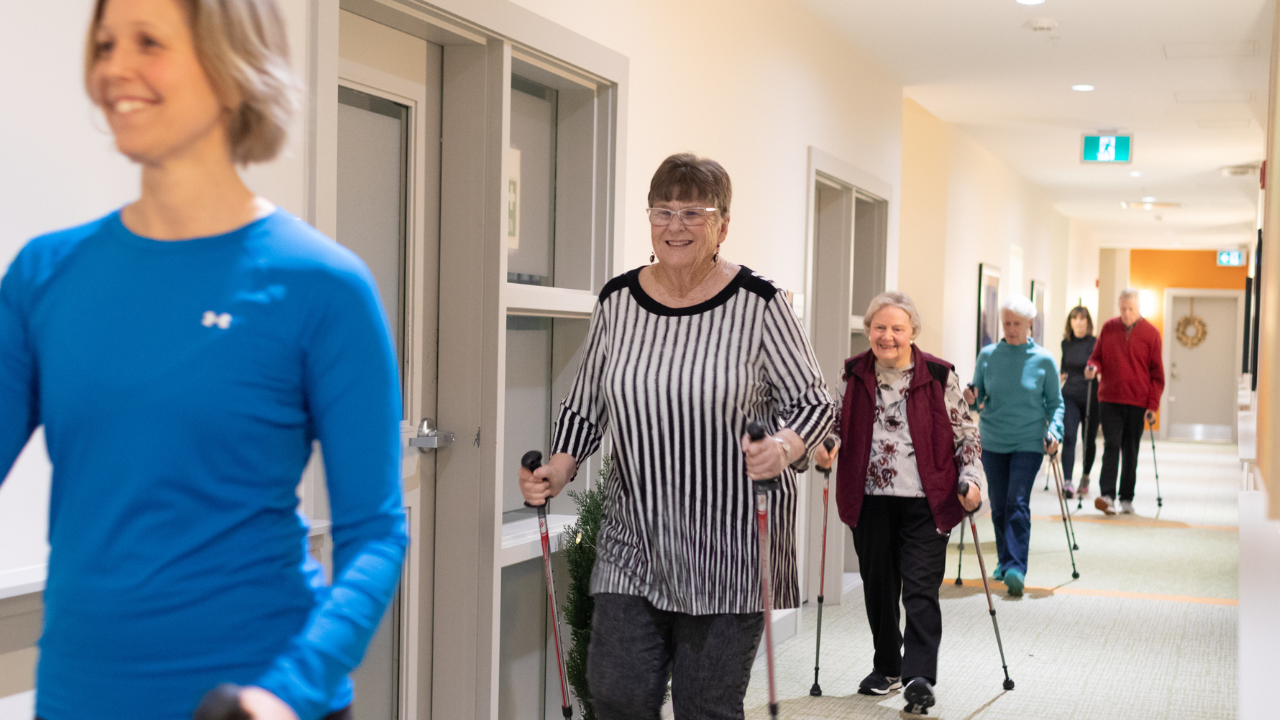 People with parkinson&#039;s walking in a hallway using their Activator poles